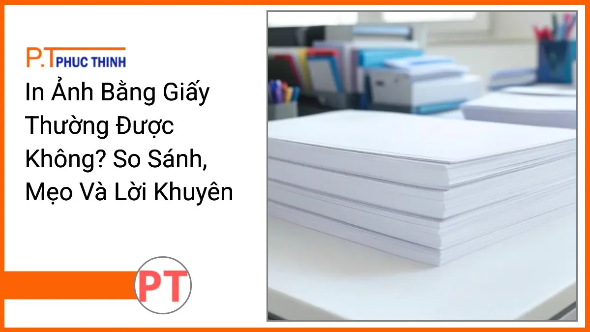 Chồng giấy in thường và bộ văn phòng phẩm PT Phúc Thịnh trên bàn làm việc gọn gàng, liên quan đến in ảnh bằng giấy thường.